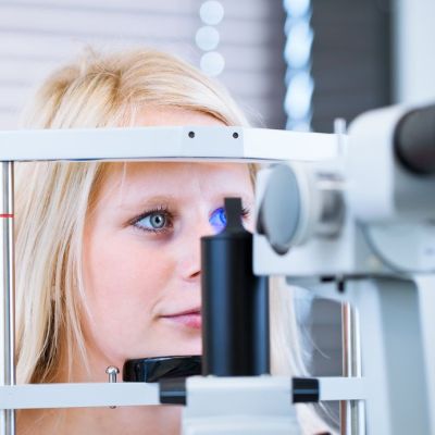Optometrist discussing vision insurance plans with a patient in Palm Desert, CA
